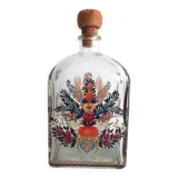 Bottle with folkloric decoration of flowers and birds inspired by Eastern countries