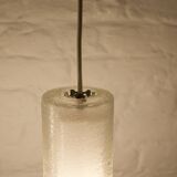 Doria pendant lights in lined frosted glass.