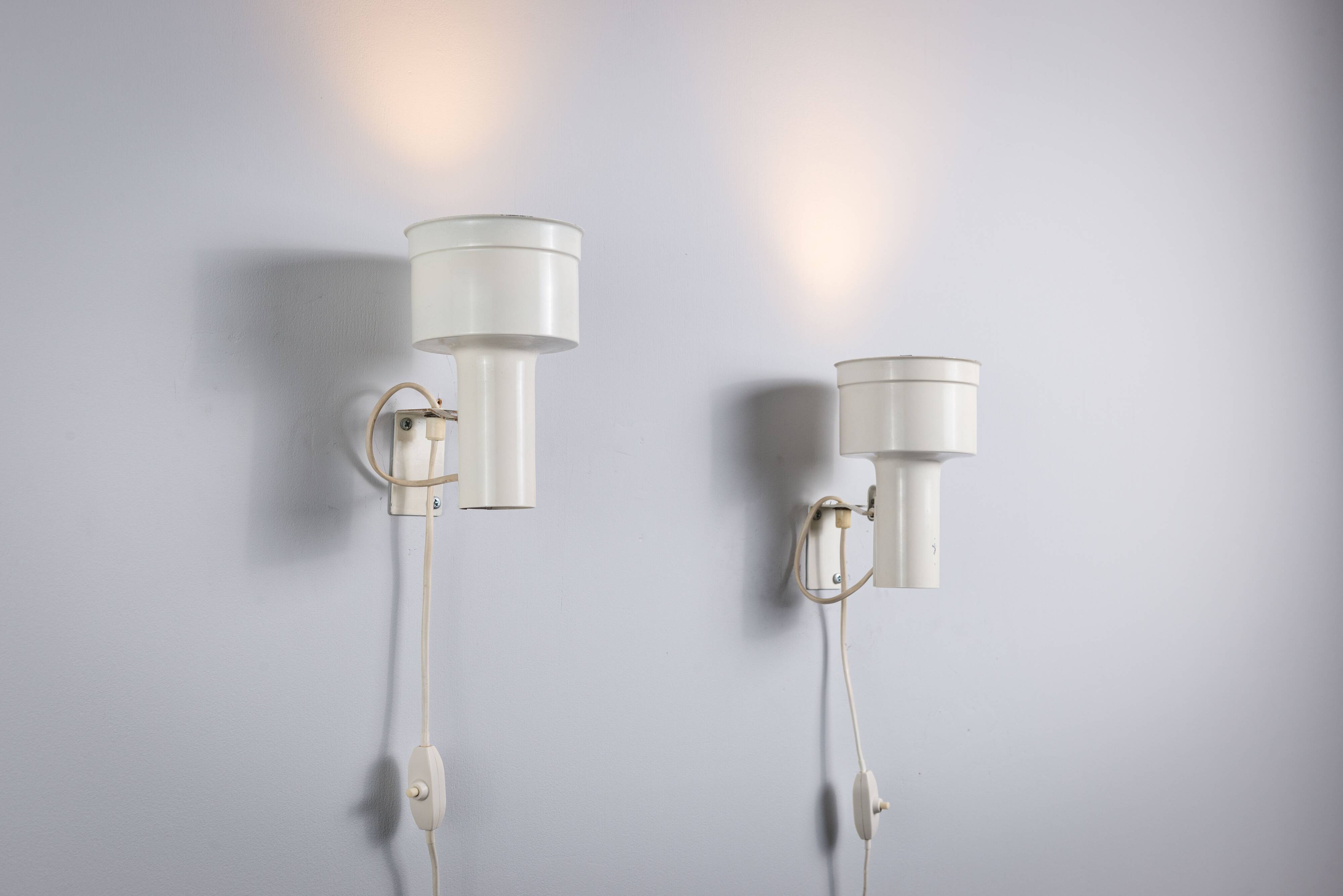 Pair of adjustable wall lamps designed by Per Sundstedt for Kosta Lampan