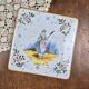 Old HB Quimper trivet – Breton woman with a distaff