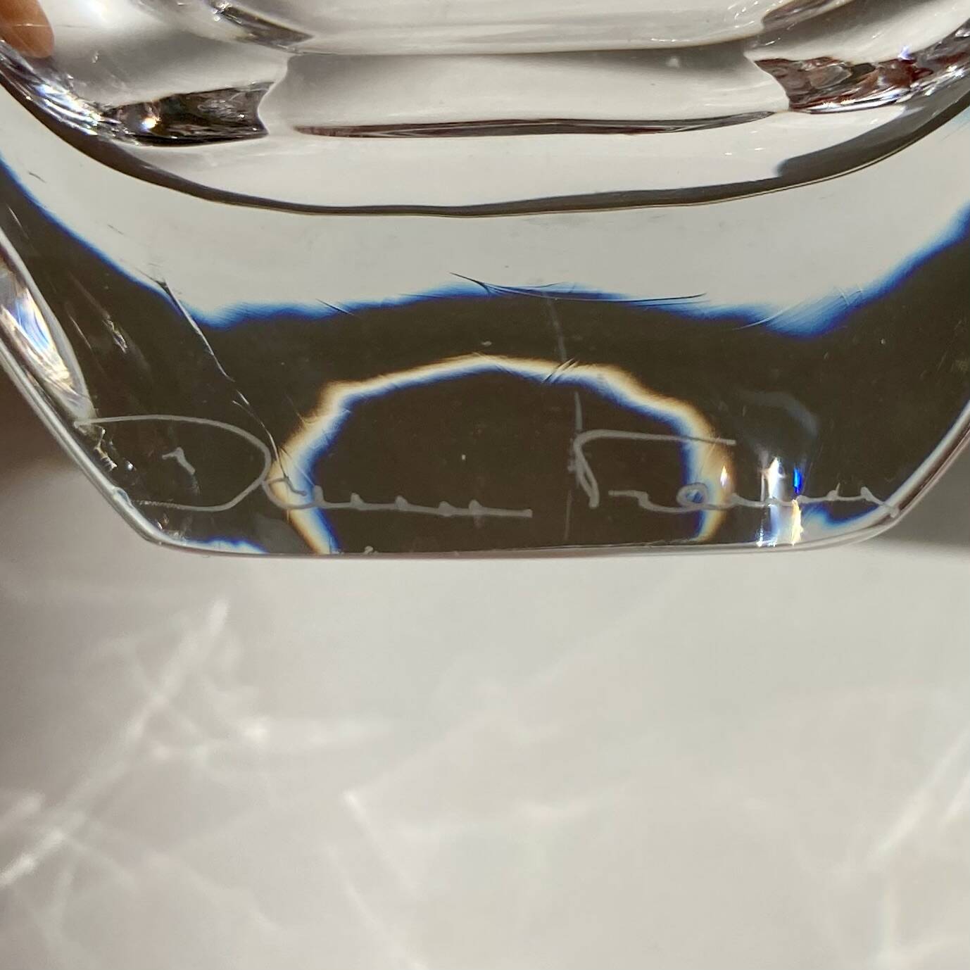 Pair of colourless crystal salt shakers from the Daum Nancy house.