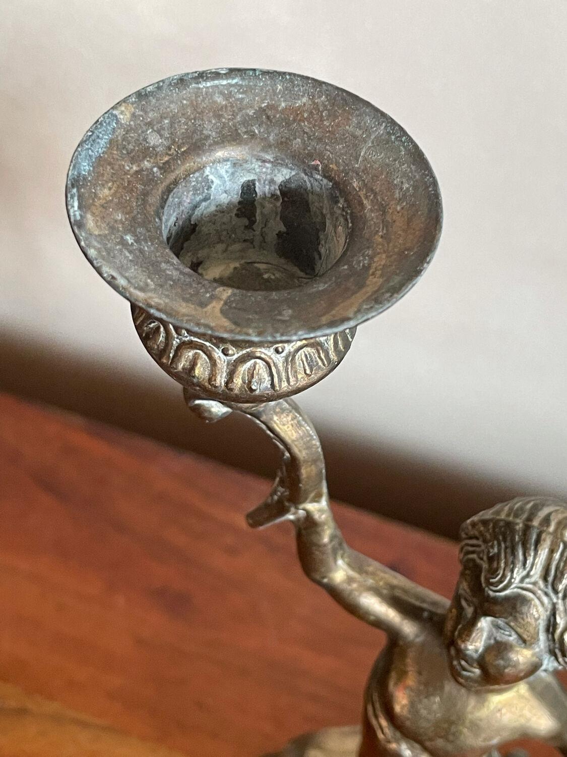 Cherub brass candle holder