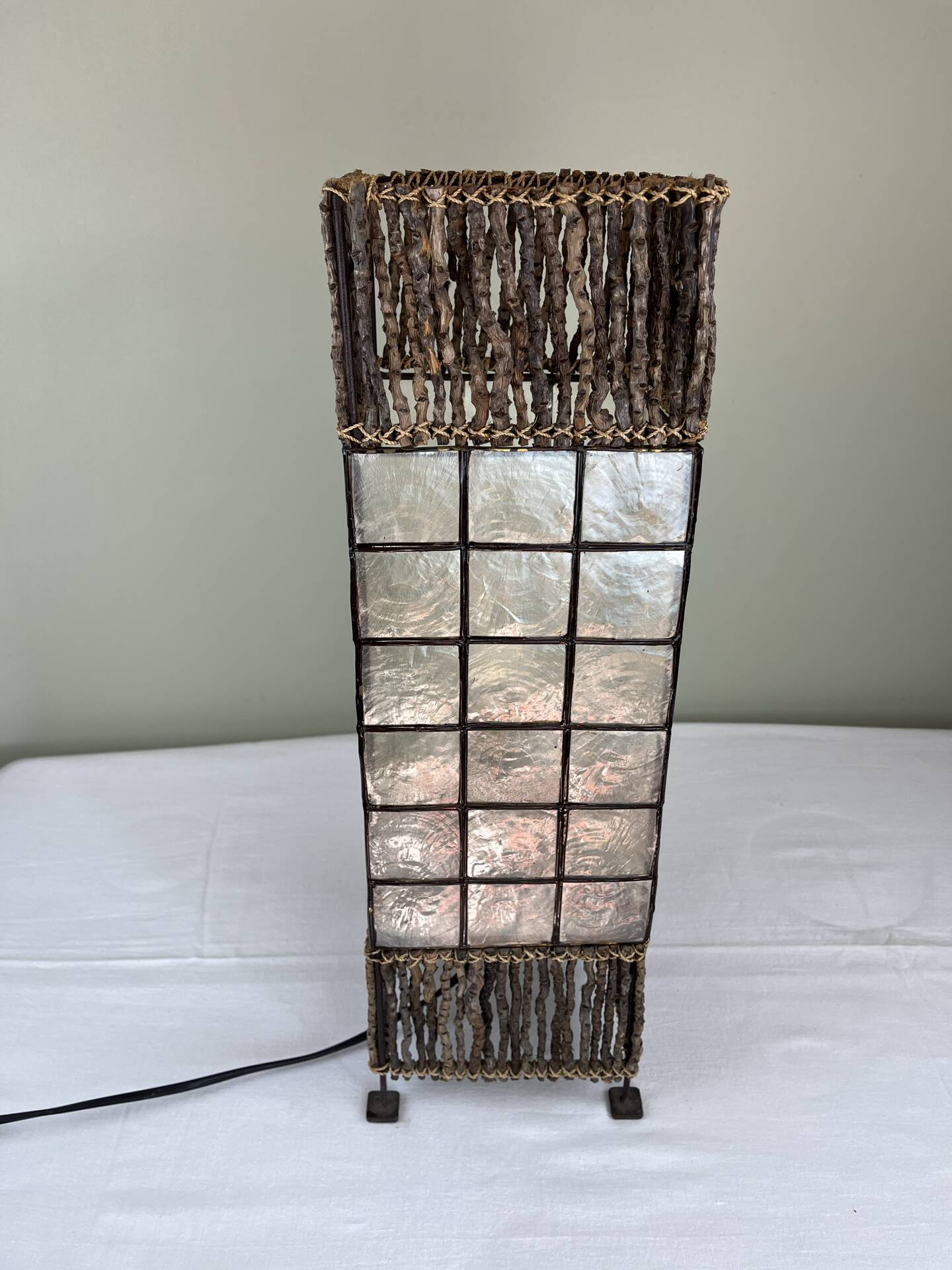 Capiz shell lamp and woven twigs