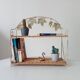Vintage wall shelf or freestanding wicker in bohemian style.