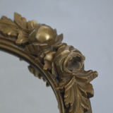 Oval mirror in gilded wood