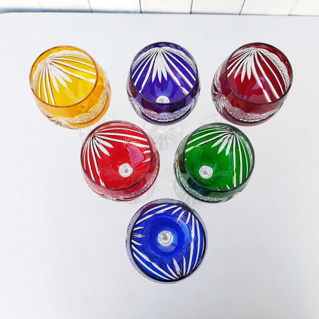 Six vintage coloured cut crystal wine glasses