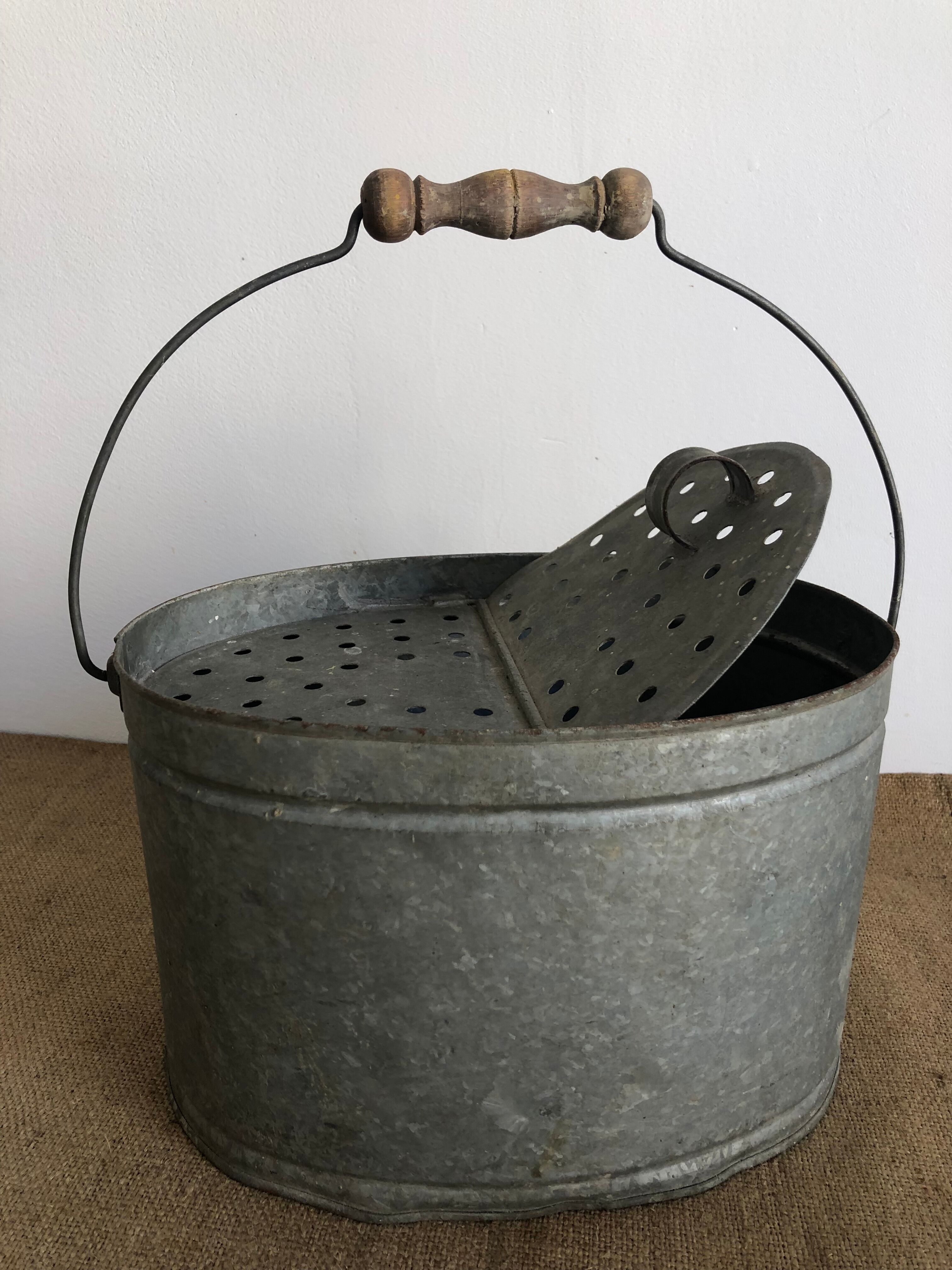 Old zinc stud, fisherman's live bucket