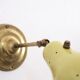 Wall lamp inlaiton and pale yellow lacquered metal
