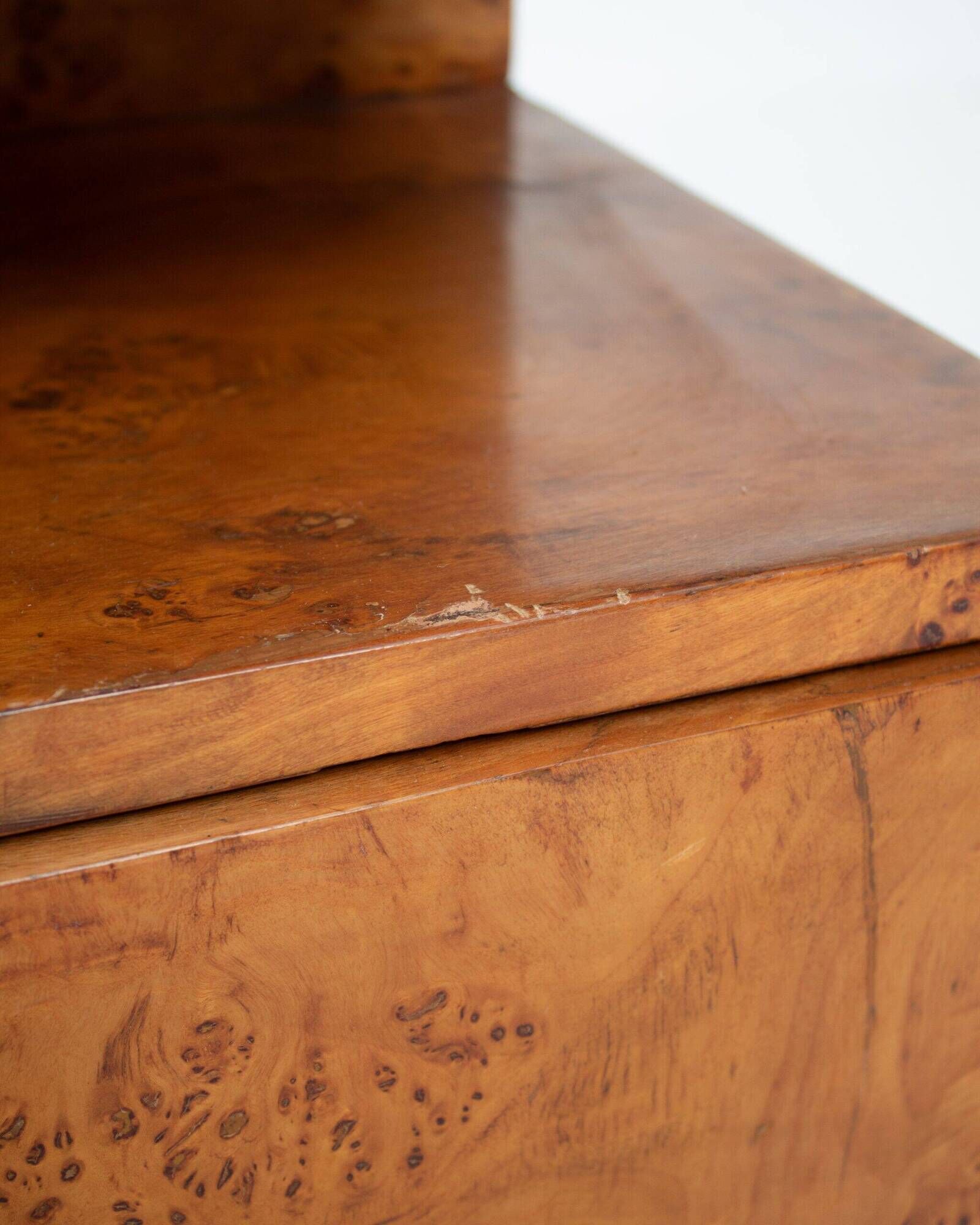 Pair of Art Deco nightstands in burlwood with black lacquered top