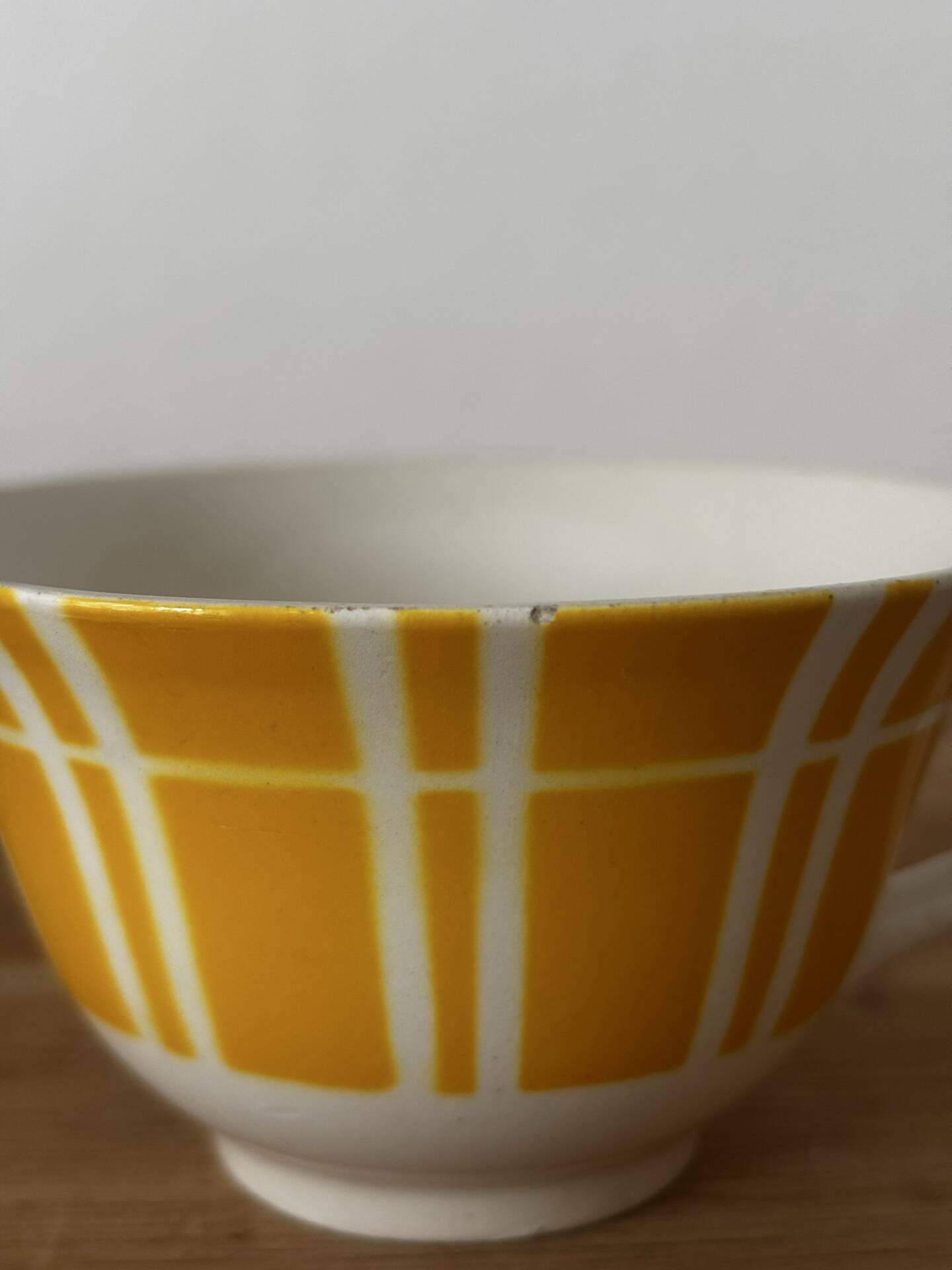 Set of two antique yellow Digoin Sarreguemines cups.