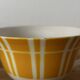 Set of two antique yellow Digoin Sarreguemines cups.