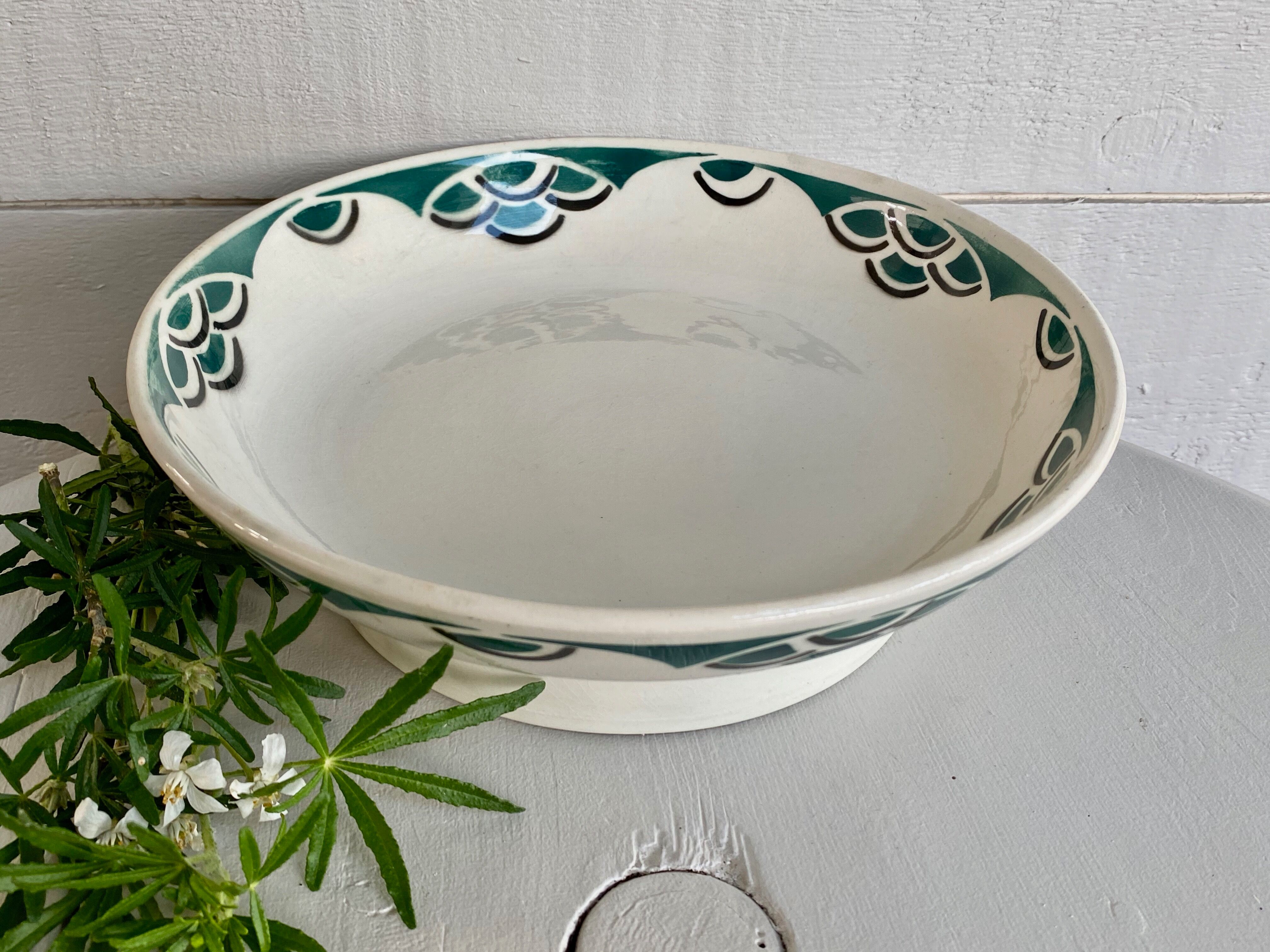 Dish on piedouche Faience of Badonviller