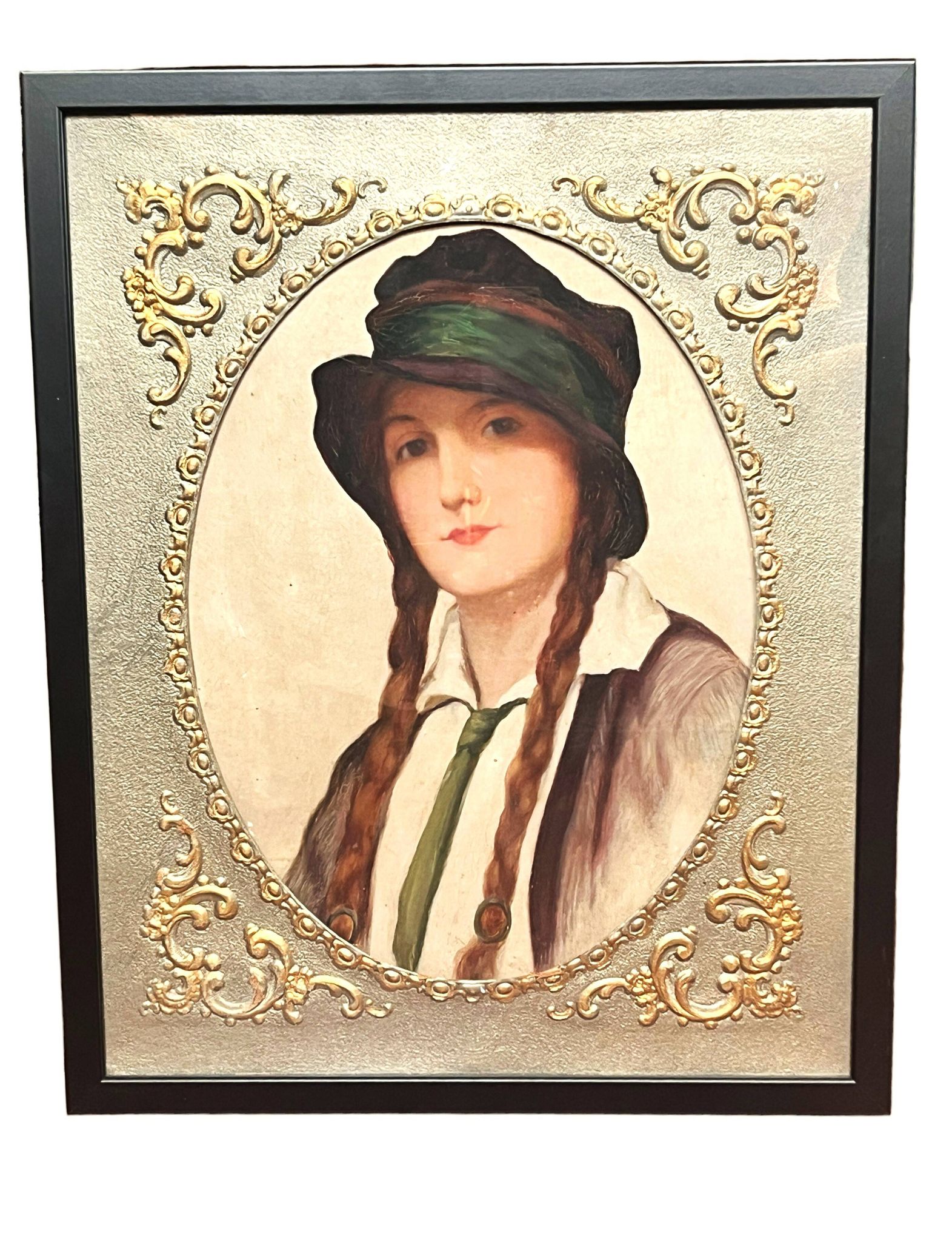 Old portrait of a young woman with braids and a hat, circa 1930