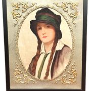 Old portrait of a young woman with braids and a hat, circa 1930