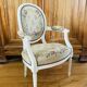 Upholstered armchair with cross-stitch in the Louis XVI style, 19th century.