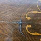 Coffee table in walnut with maple inlays and wheels