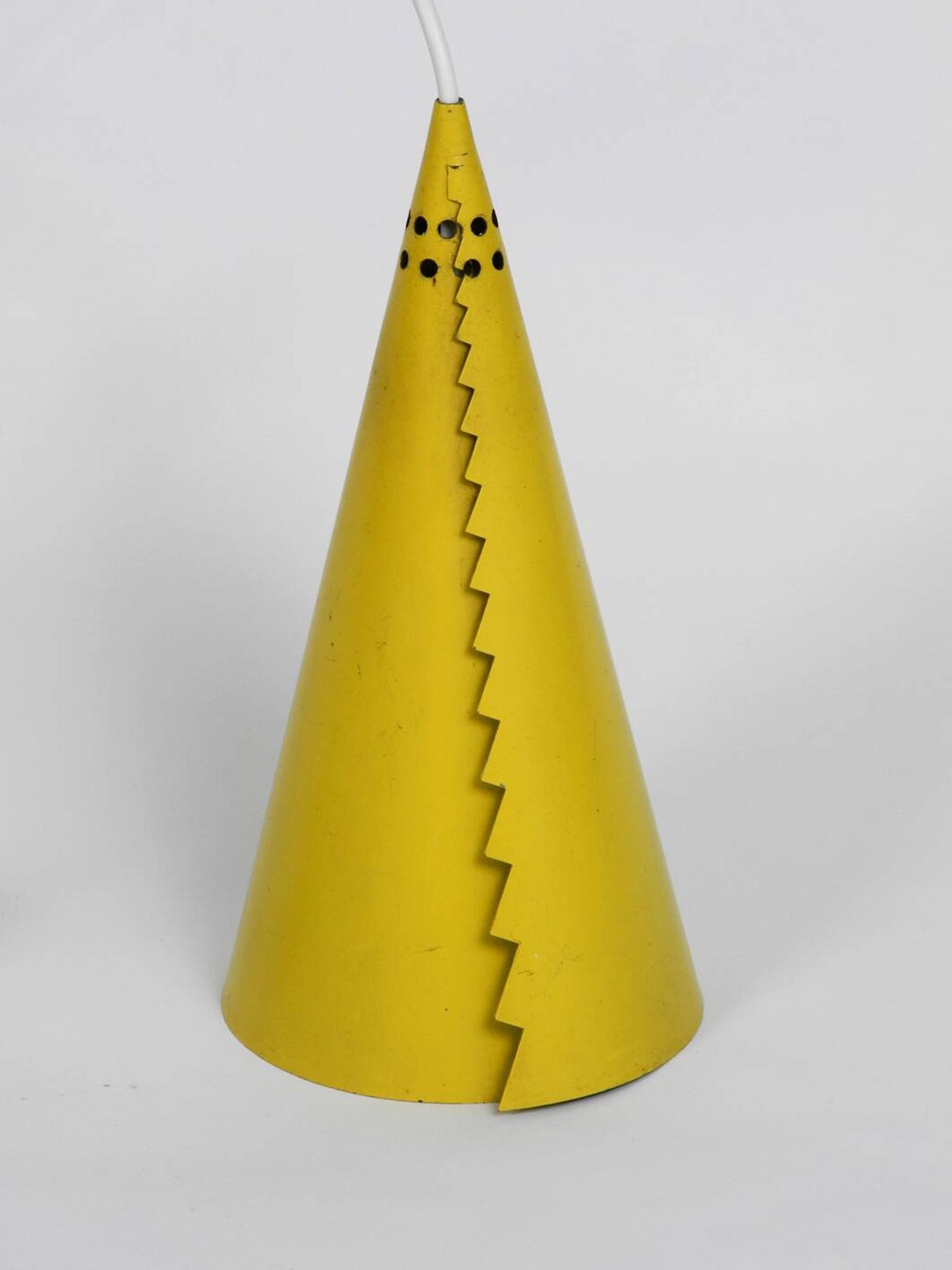 Rare Mid Century Modern cone shaped pendant lamp made of sheet steel in yel