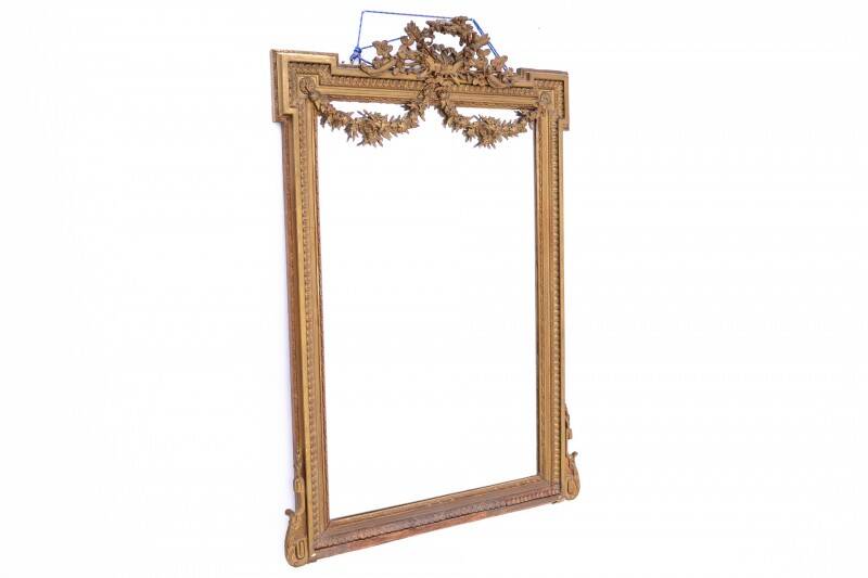 Large mirror in a gold frame, France.