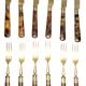 Table art, 12 fruit cutlery sets in gilded metal with horn from the early 20th century.