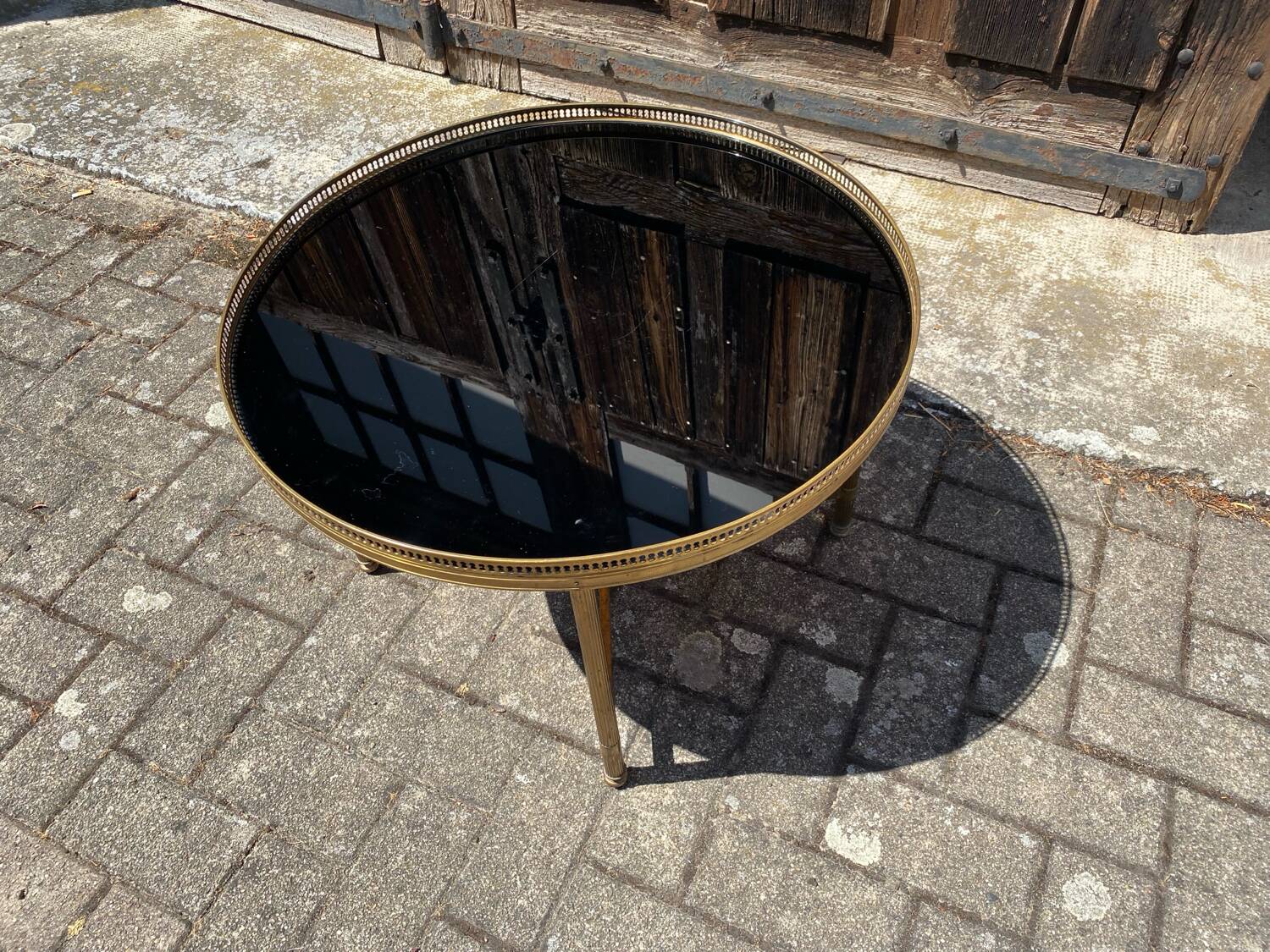 Neoclassical coffee table in black opaline glass and gilt bronze, circa 1970