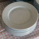 24 white ceramic brewery plates