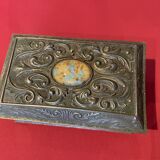 Ancient box made of chiseled metal and stone