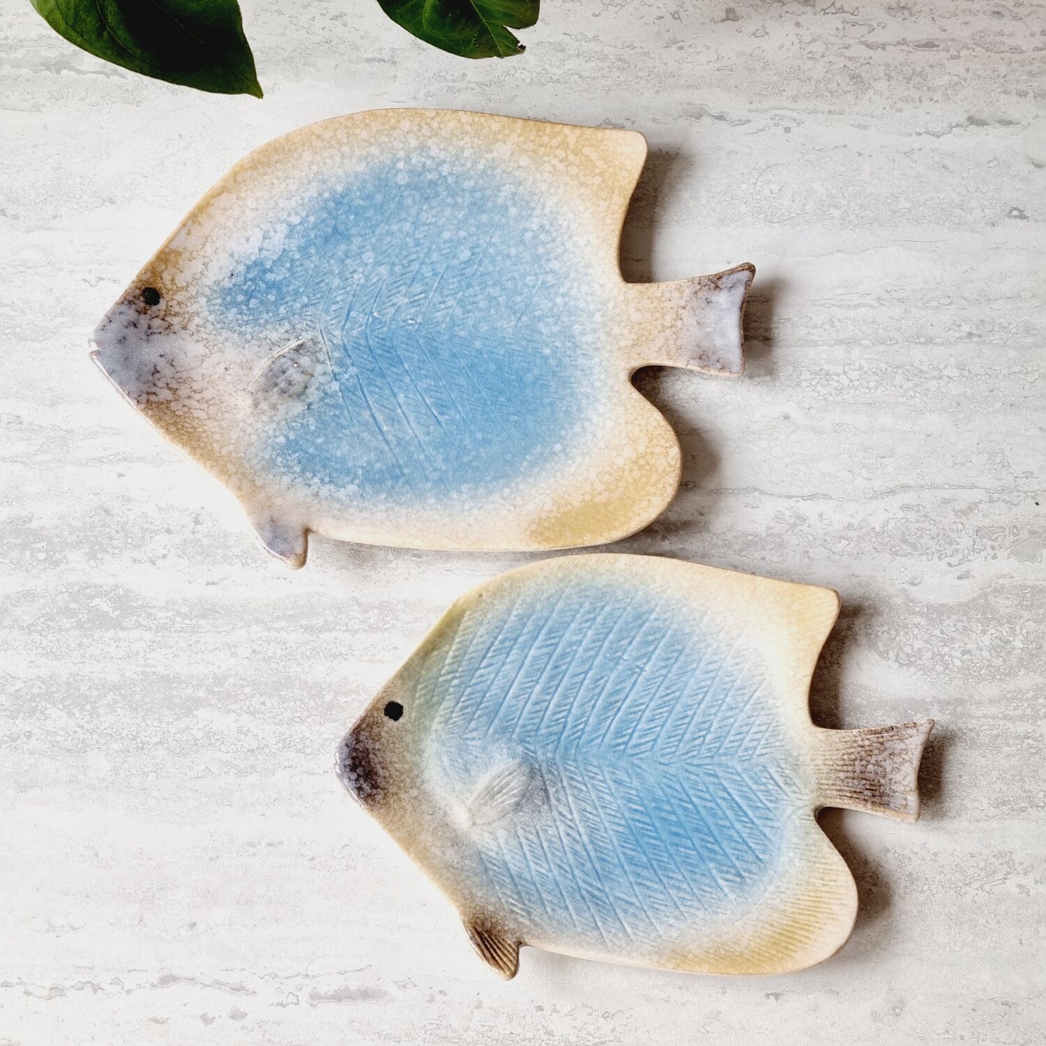 2 empty ceramic fish pockets