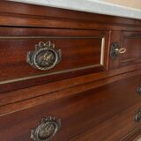 Louis XVI style commode with a shaped marble top.