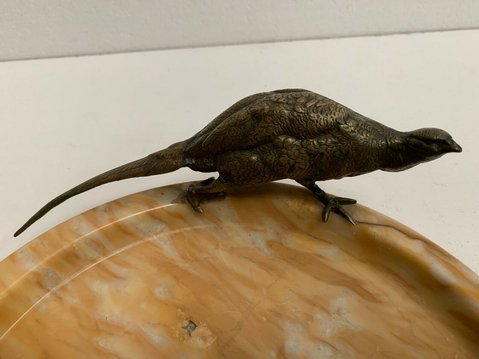 Empty marble pocket has 20th century bronze bird decoration