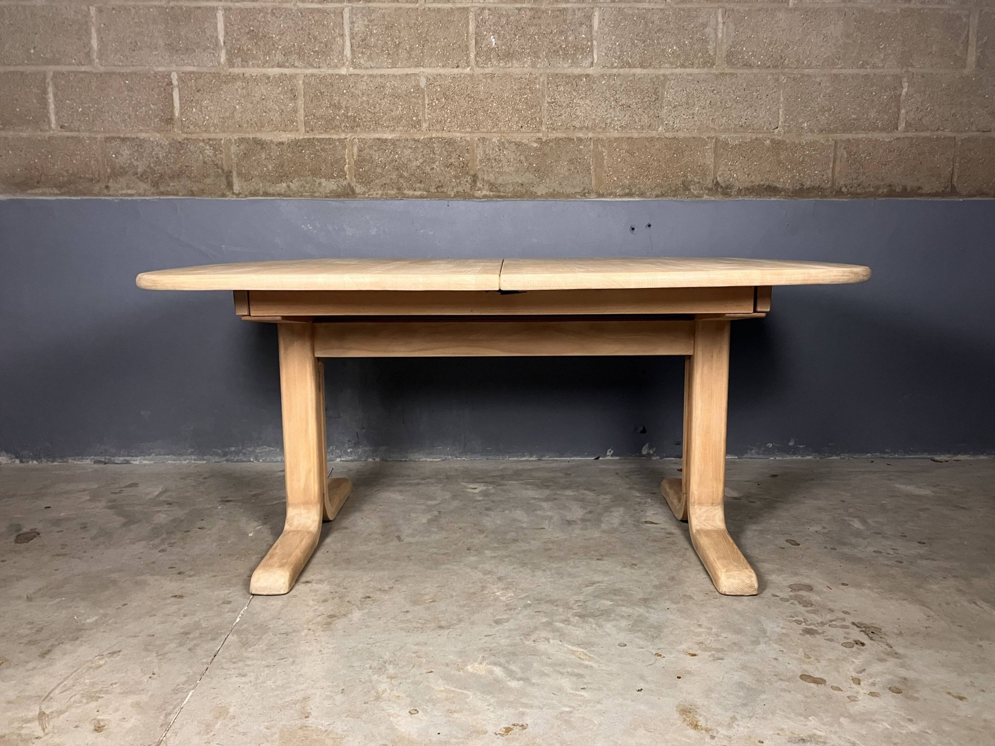 Oval extendable dining table in beech with Danish design.