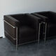Pair of modernist brown leather armchairs