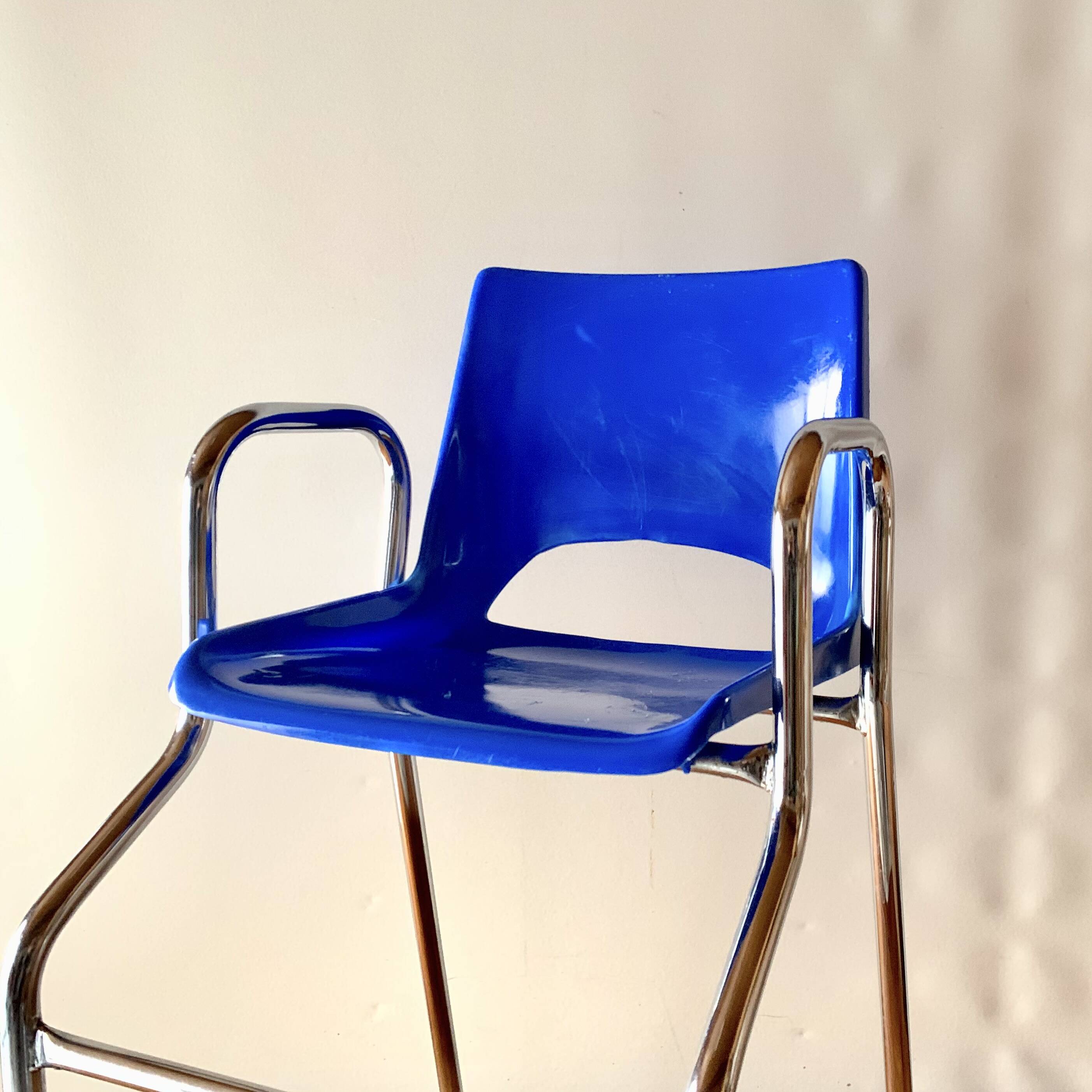 Vintage high chair for children in chrome metal and blue plastic