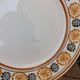 10 dessert plates Saint Amand Amandinoise frilled with orange and black flowers.