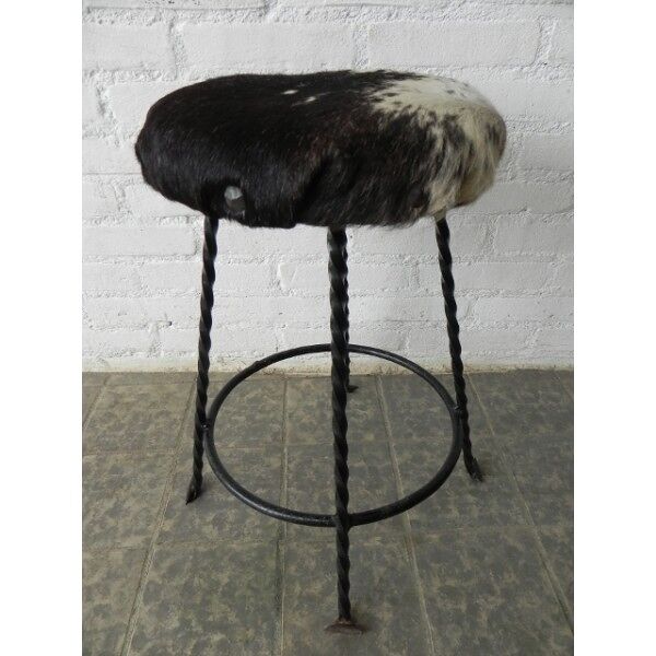 Tabouret vintage bordée de peau de vache