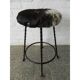 Vintage stool lined with cowhide
