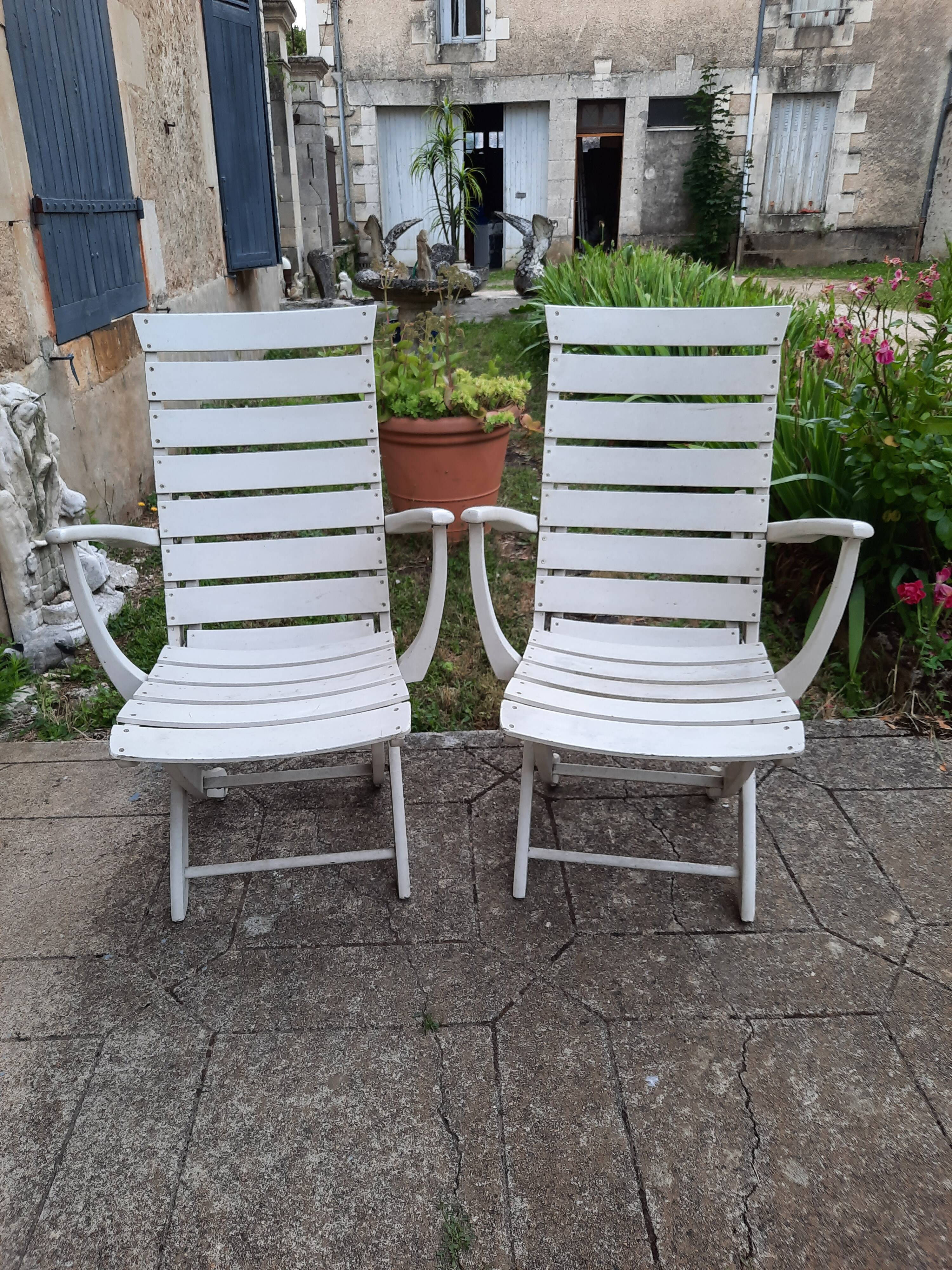 Pair of wooden garden armchairs