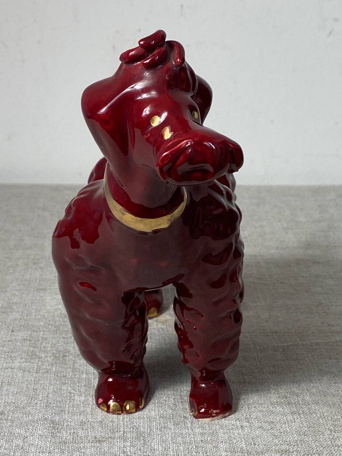 Burgundy and gold ceramic dog