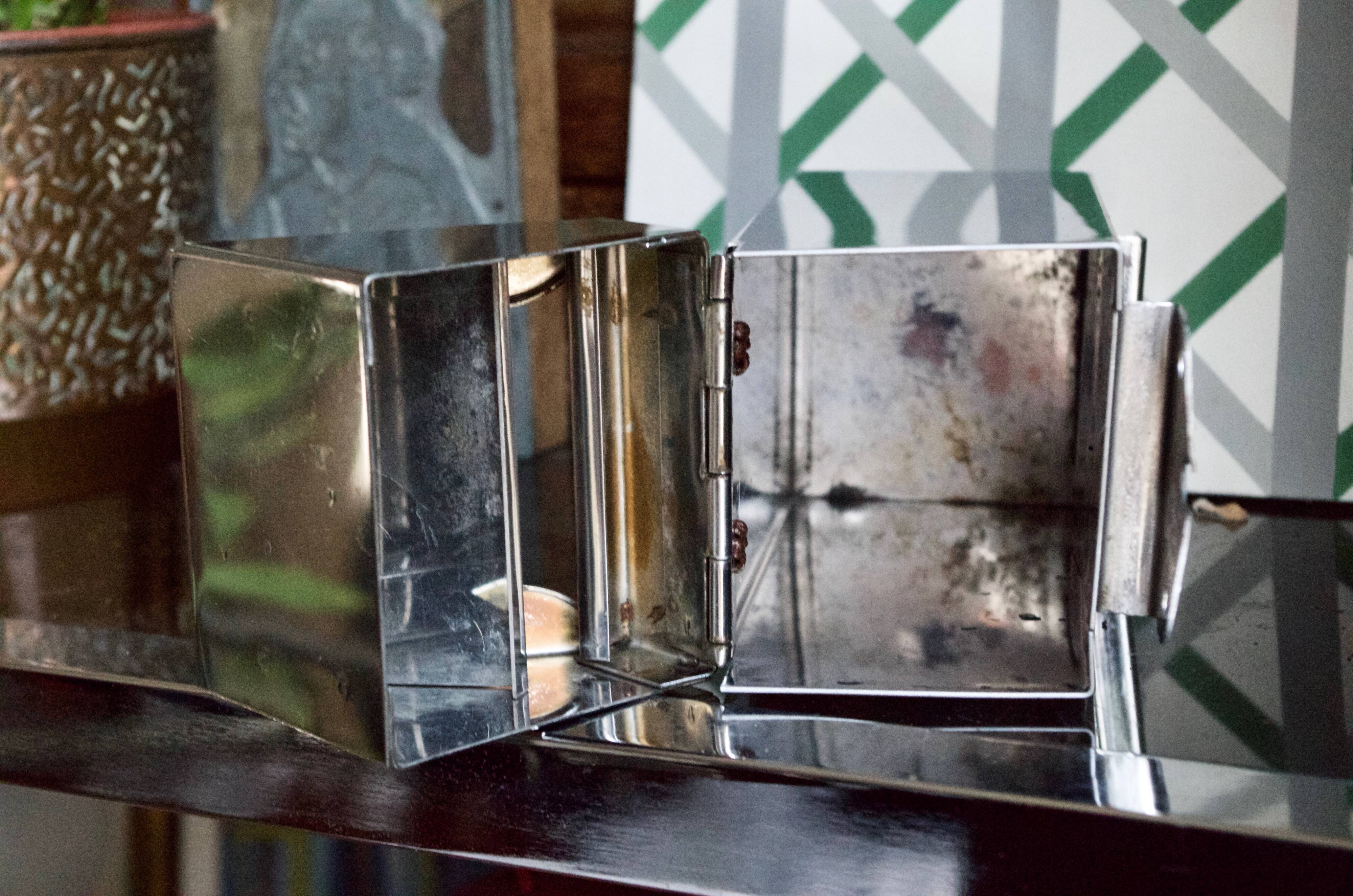 Vintage wall ashtray in shiny metal industrial style