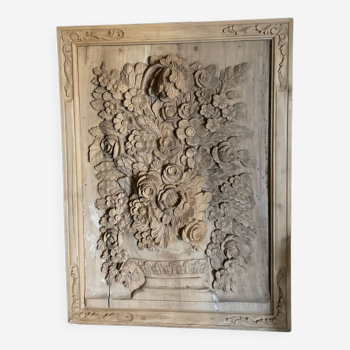 wooden painting with carved floral motif - note a restoration on the left side at the bottom.