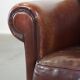 Design armchair made of sheep leather with a clean finish