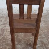 Old children's chair in solid teak