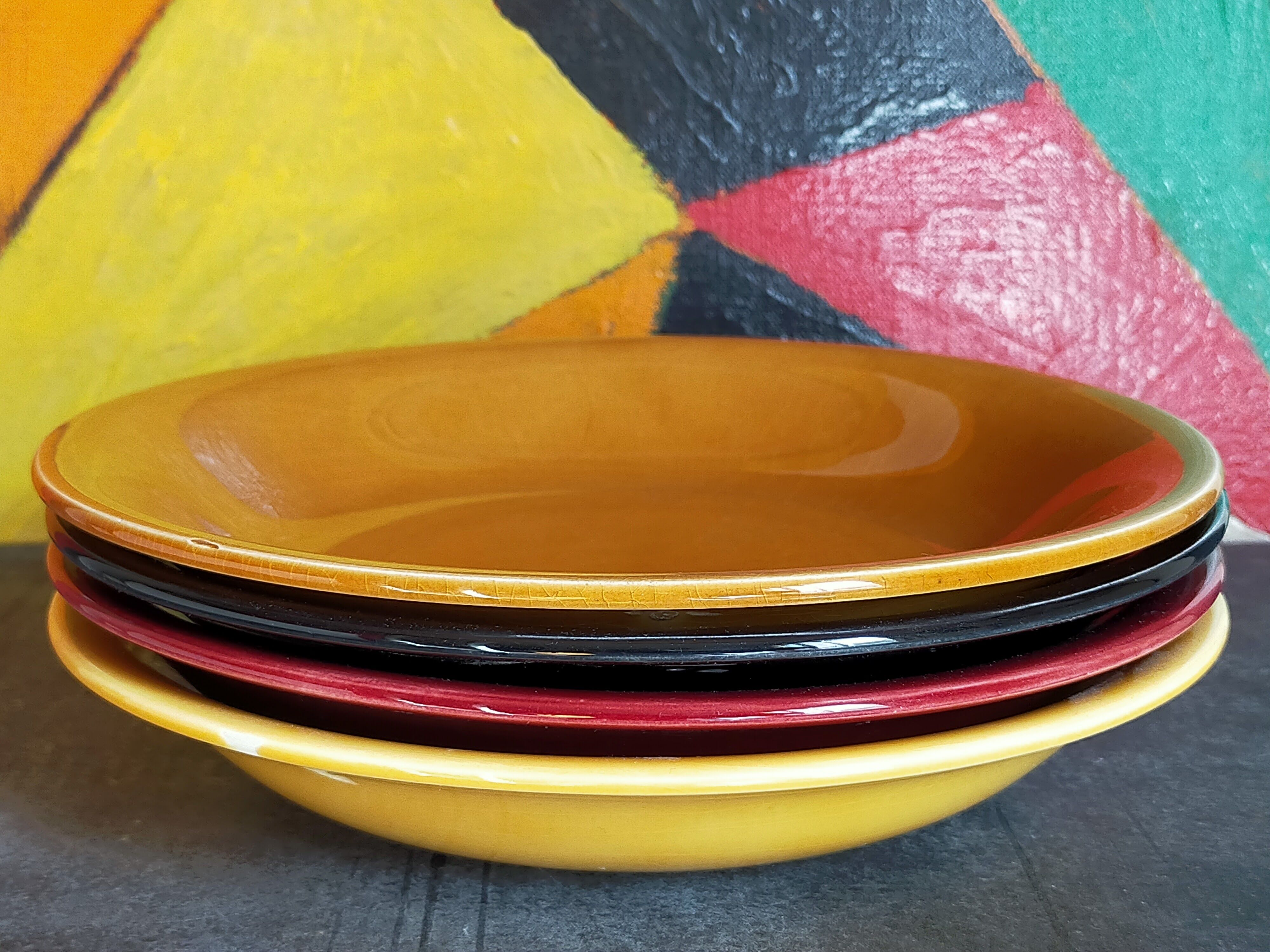 Four multicolored soup plates from the 1950s