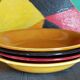 Four multicolored soup plates from the 1950s