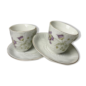 duo of porcelain cups and subcups floral motifs