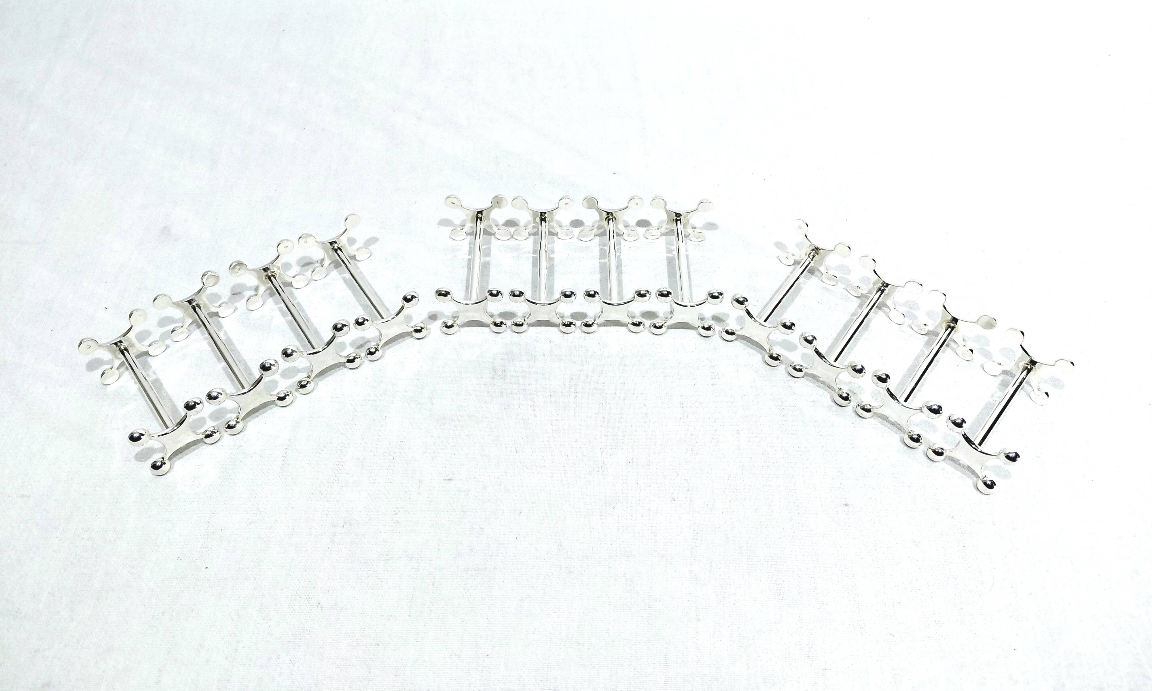 SET OF 12 SILVER-PLATED KNIFE RESTS