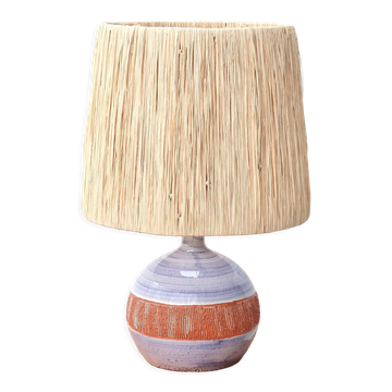 Ceramic lamp by Christian Muratore with a raffia lampshade.
