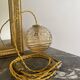 Baladeuse globe vintage en verre ambré 