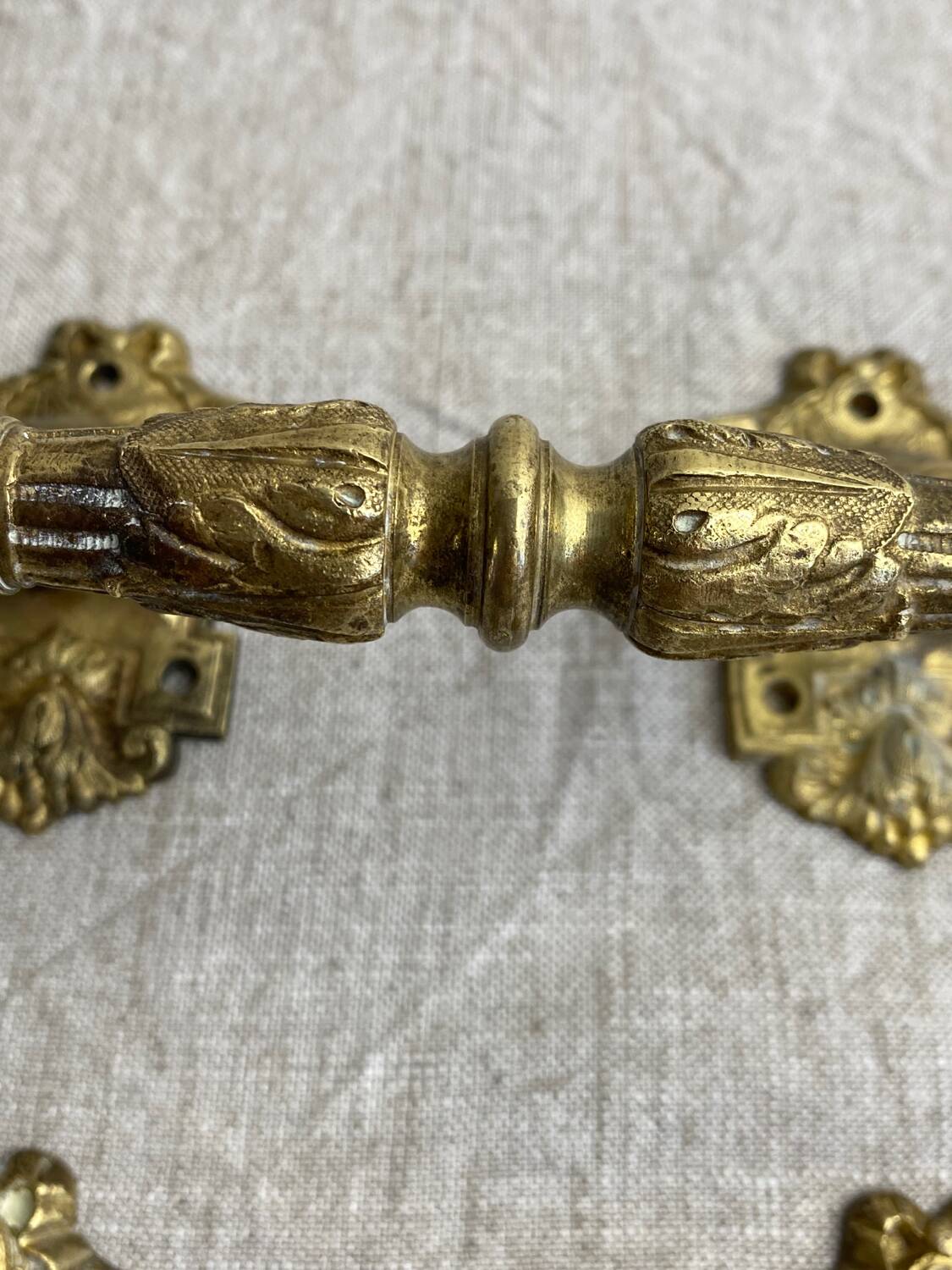 Articulated bronze handles