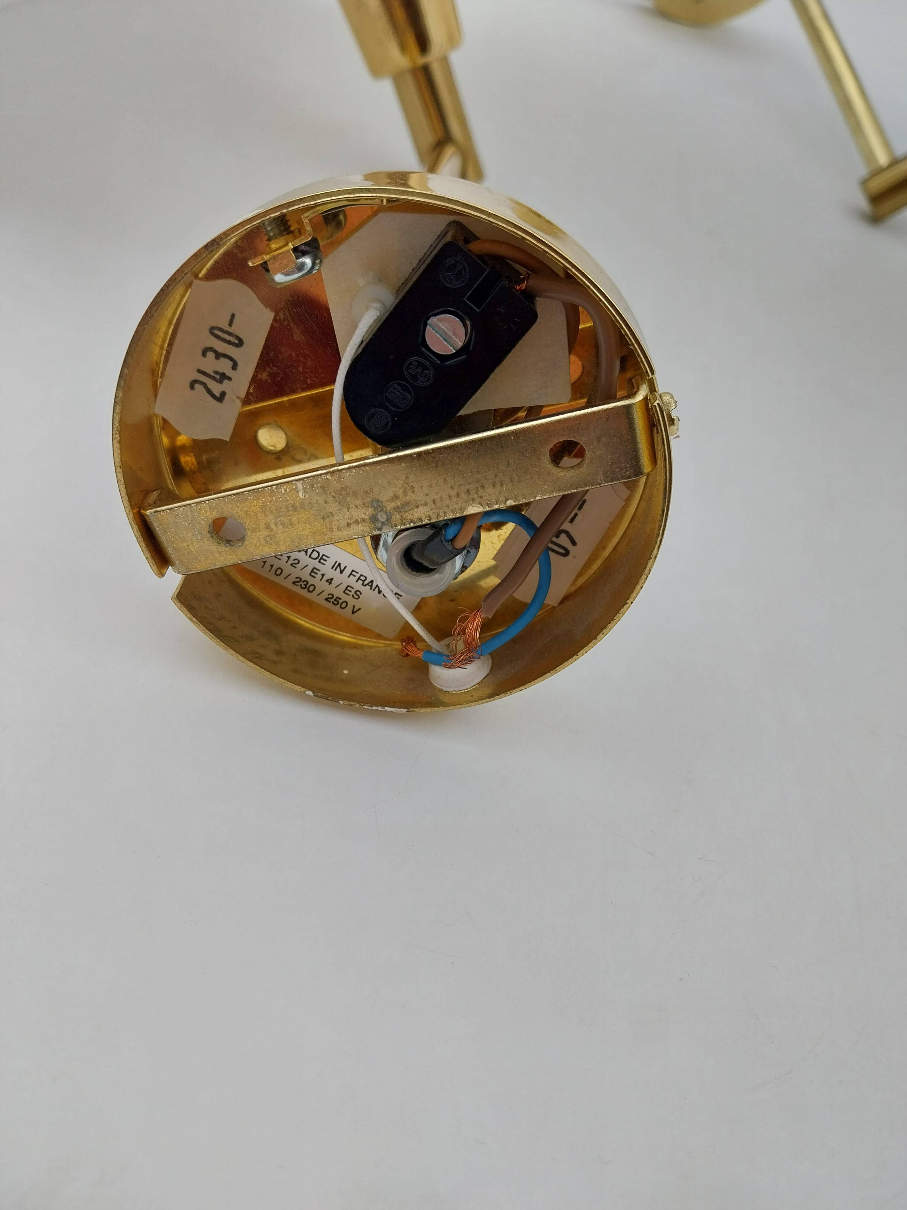 Pair of articulated arm wall lights in brass with opaline globe