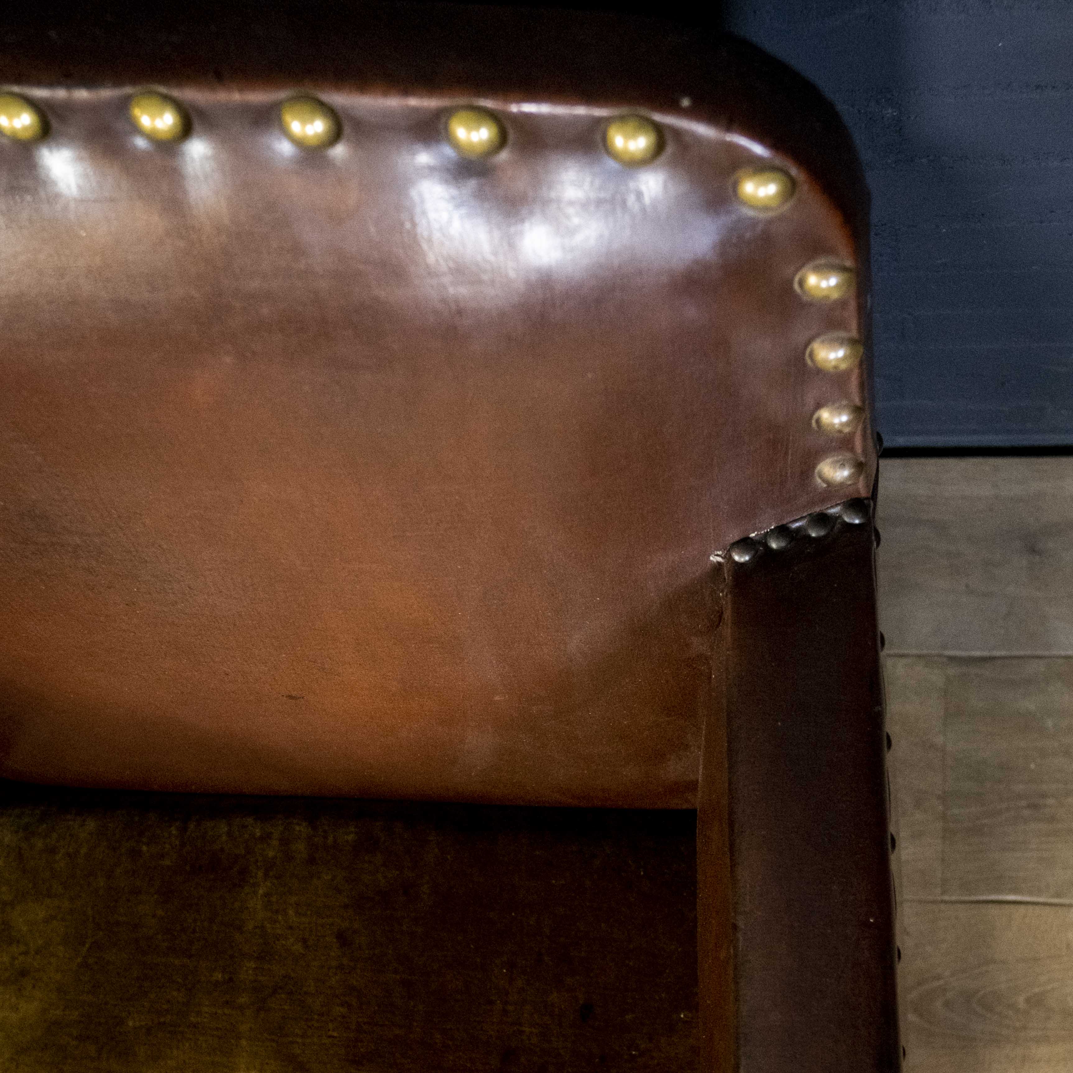 Antique club armchair of leather cloth